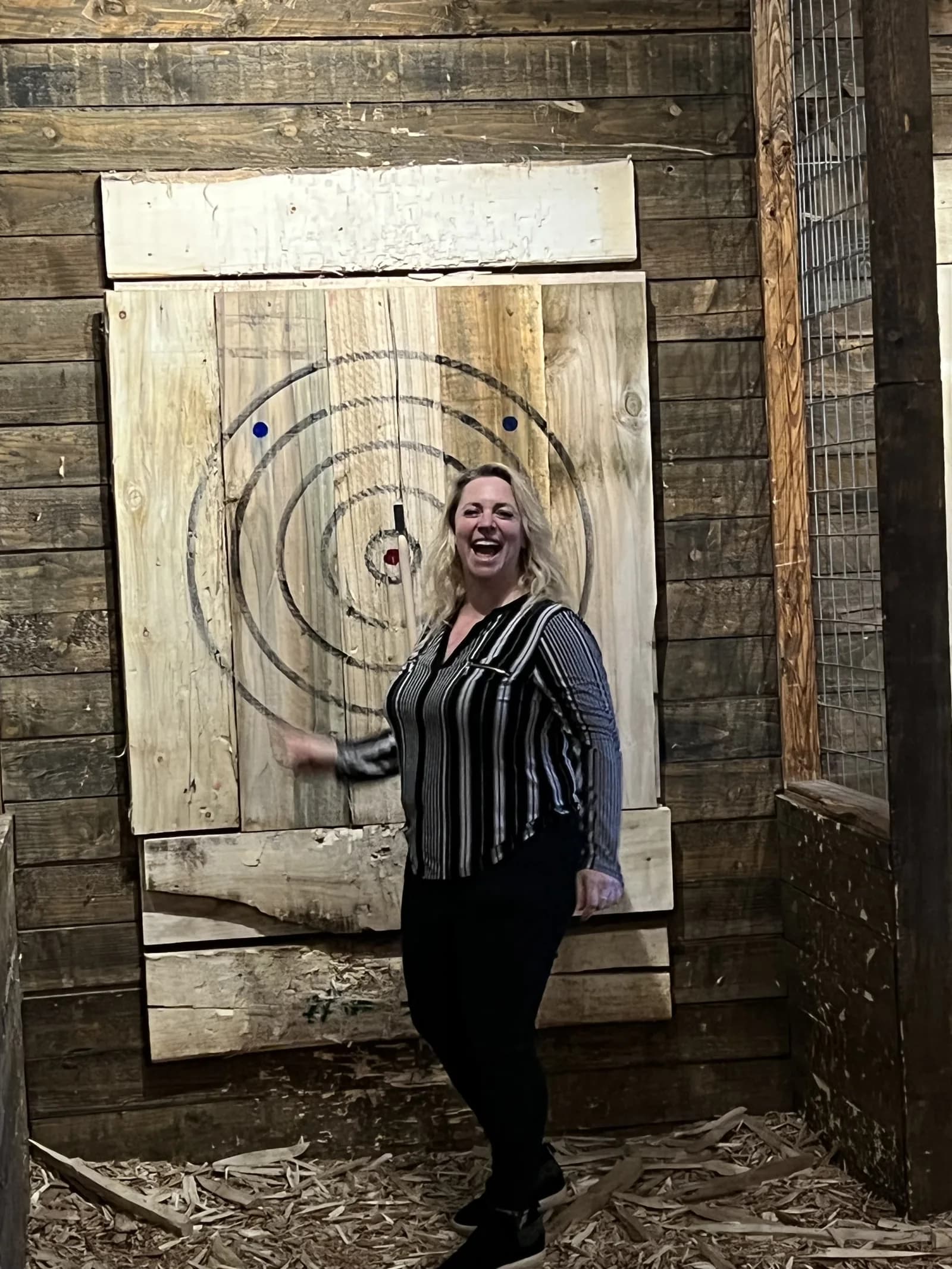 A team member at the axe-throwing outing